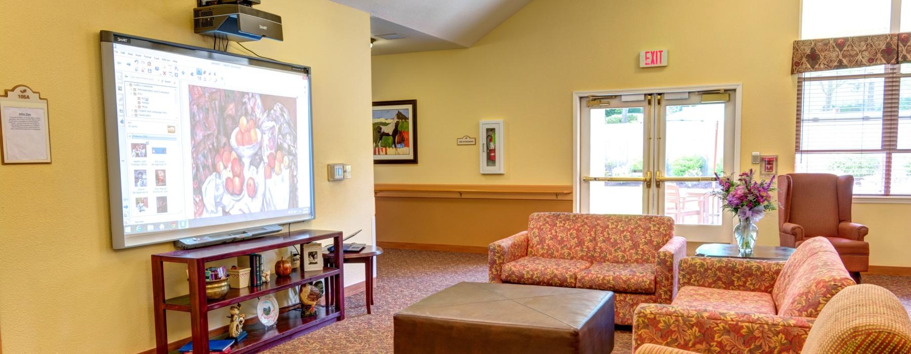 a living room with a tv and couches